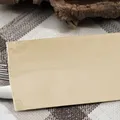 Weiteres Produktbild Bestecktasche Champagner mit weißer Serviette [125 Stück]